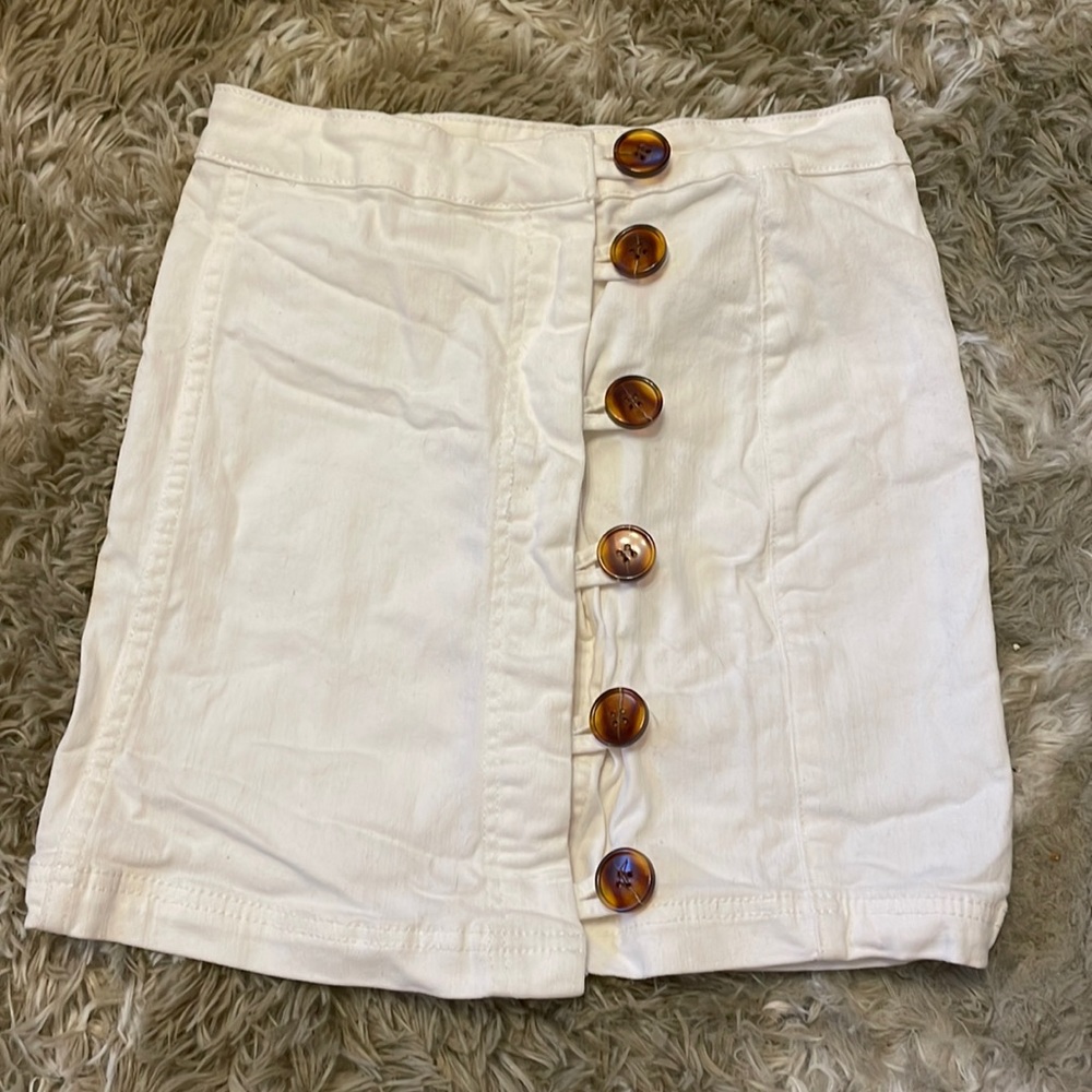 blue blush white denim mini skirt. Waist: 25 inches, size small.